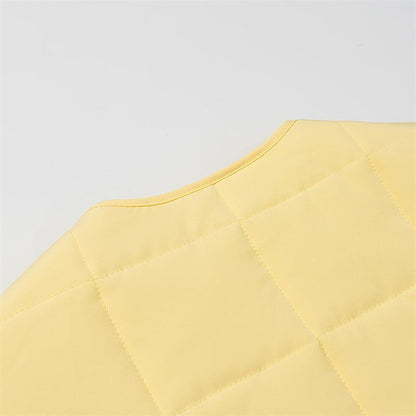 Quilted women's jacket with large applied pockets and elegant button closure system Chic und Stil