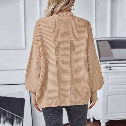 Veste en tricot pour femmes avec design en torsades et détails en boutons dorés Chic und Stil