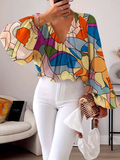 Blouse pour femmes avec décolleté en V et design graphique à la mode Chic und Stil