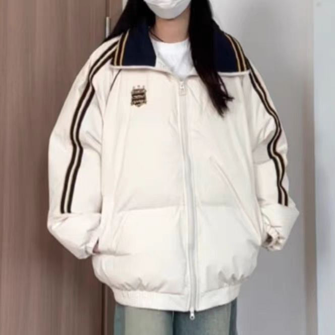 Dame Veste matelassée sportive avec des bandes contrastées et un col haut Chic und Stil