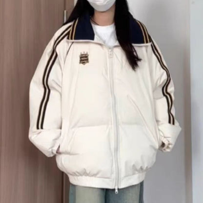 Dame Veste matelassée sportive avec des bandes contrastées et un col haut Chic und Stil