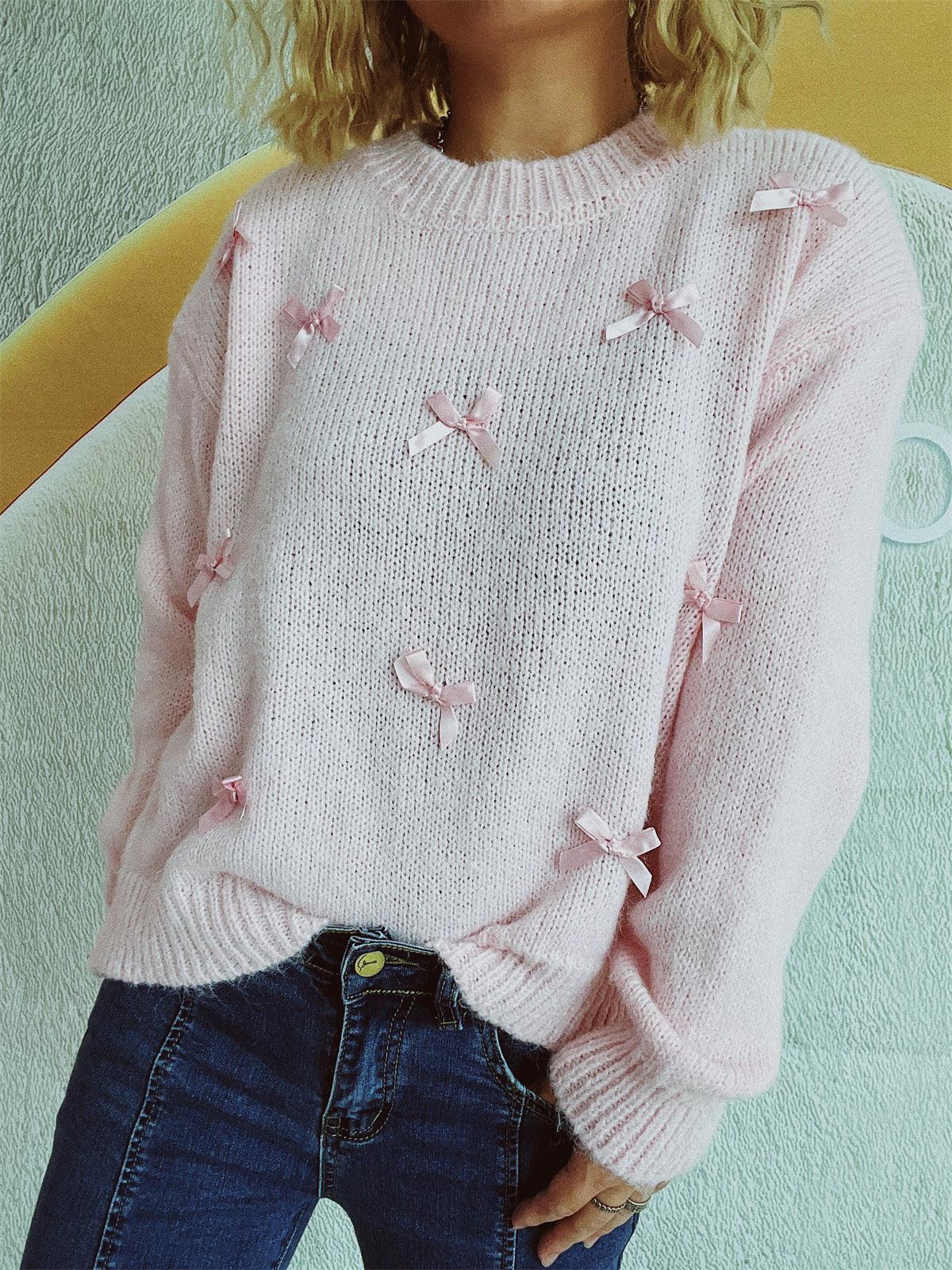 Pull en tricot pour femmes avec des accents de nœuds ludiques Chic und Stil
