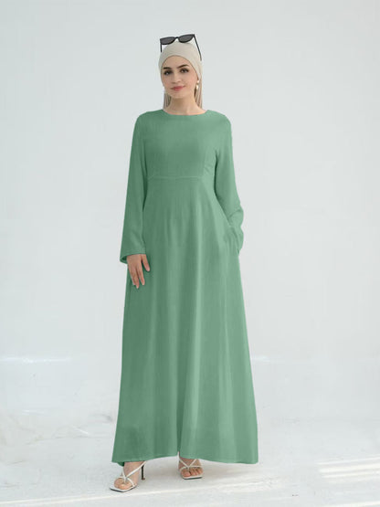 Robe maxi élégante pour dames avec des manches longues et des poches latérales Chic und Stil