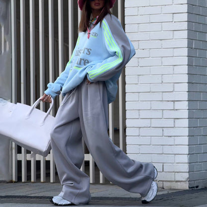 Ladies Casual Sports Outfit with a Relaxed Sweatshirt and Comfortable Jogging Pants Chic and Style