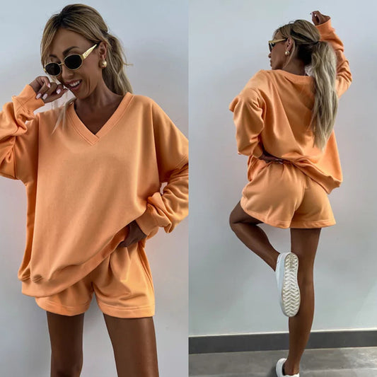 Casual outfit for women with oversized V-neck sweater and shorts Chic and Style