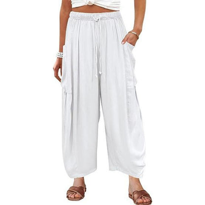 Casual harem pants for women with practical side pockets and loose fit Chic and Style