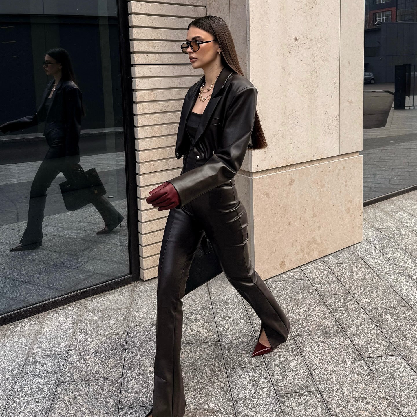 Elegant leather jacket for women with trendy blazer and slim pants