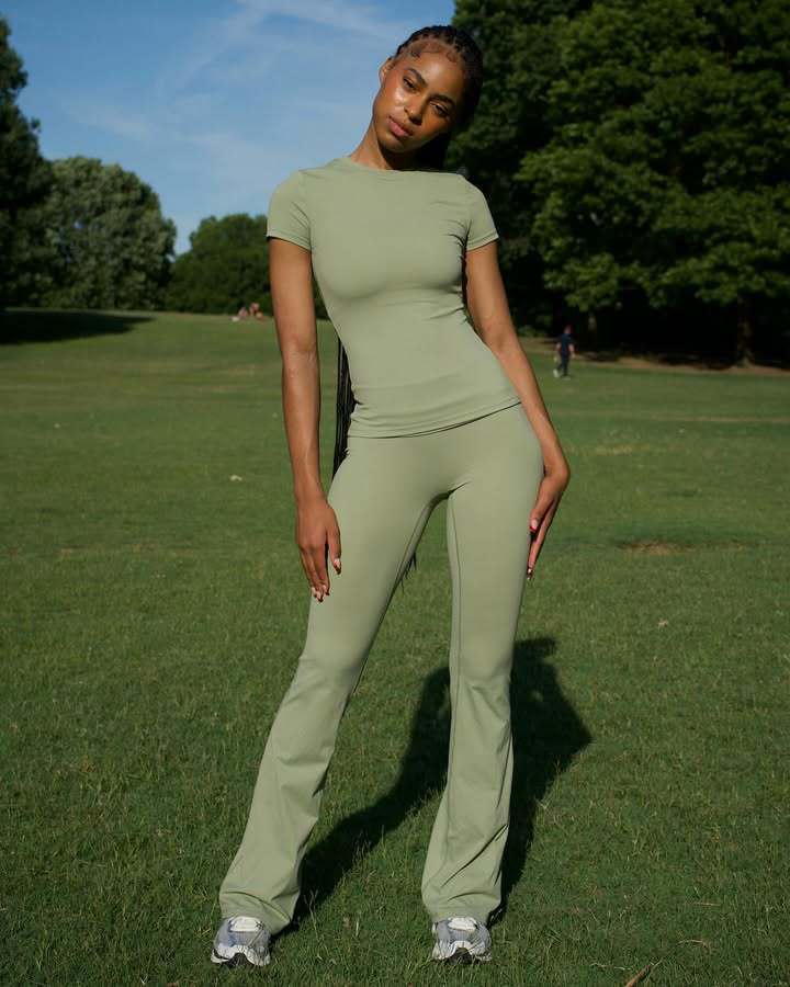 Chic and Style ladies' sporty outfit with fitted top and flared pants