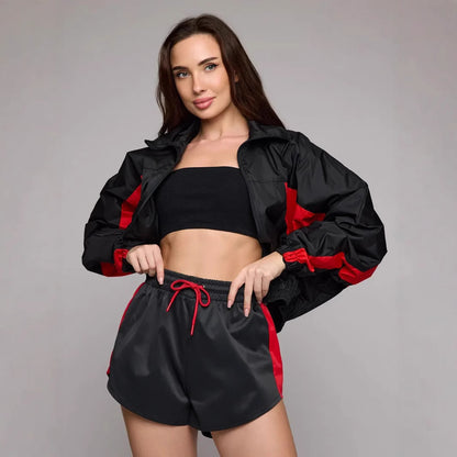 Women's athletic workout clothing with a highly functional jacket and chic stylish shorts