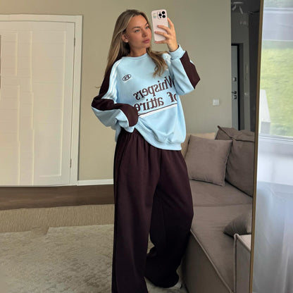 Ladies Casual Sports Outfit with a Relaxed Sweatshirt and Comfortable Jogging Pants Chic and Style