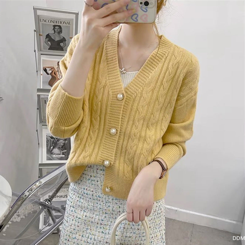 Knitted jacket for women with an elegant braid pattern and high-quality button details Chic and Style