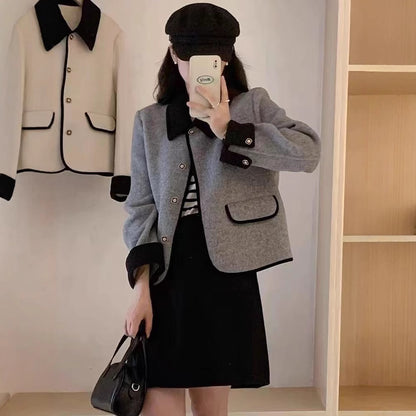 Dame élégante veste courte avec des détails contrastants Chic und Stil