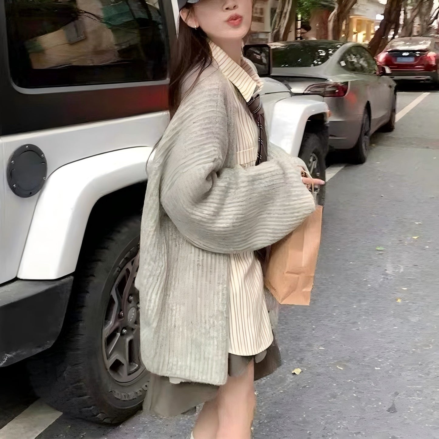 Women's comfortable knitted vest with button closure and chic, stylish V-neck