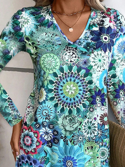 Robe blouse à col en V ludique pour femmes avec des motifs floraux et des manches longues Chic und Stil