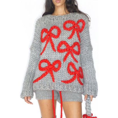 Pull en gros tricot pour femmes avec un design de nœud ludique Chic und Stil