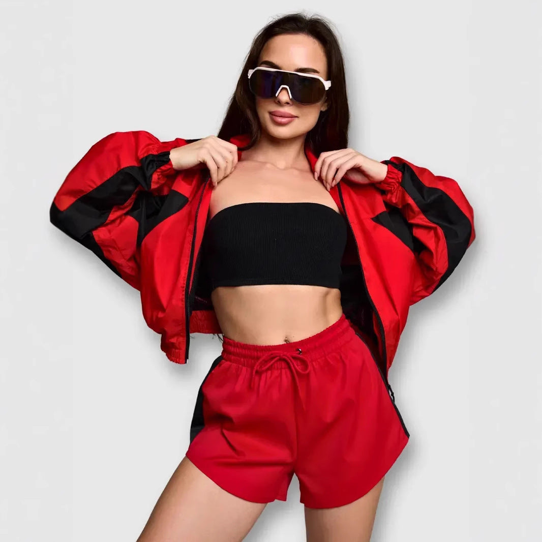 Women's athletic workout clothing with a highly functional jacket and chic stylish shorts