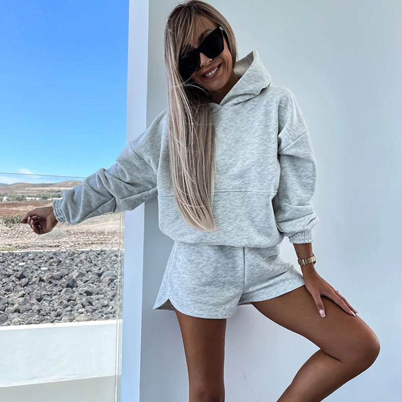 Fashionable women's set consisting of a comfortable hoodie and chic shorts