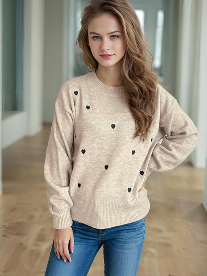 Pull femme avec un design de cœur ludique Chic und Stil