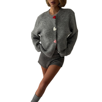 Ladies cozy knit pullover with heart-shaped buttons Chic and Style