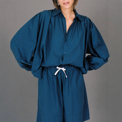 Woman casual outfit combined with loose blouse and shorts Chic and Style