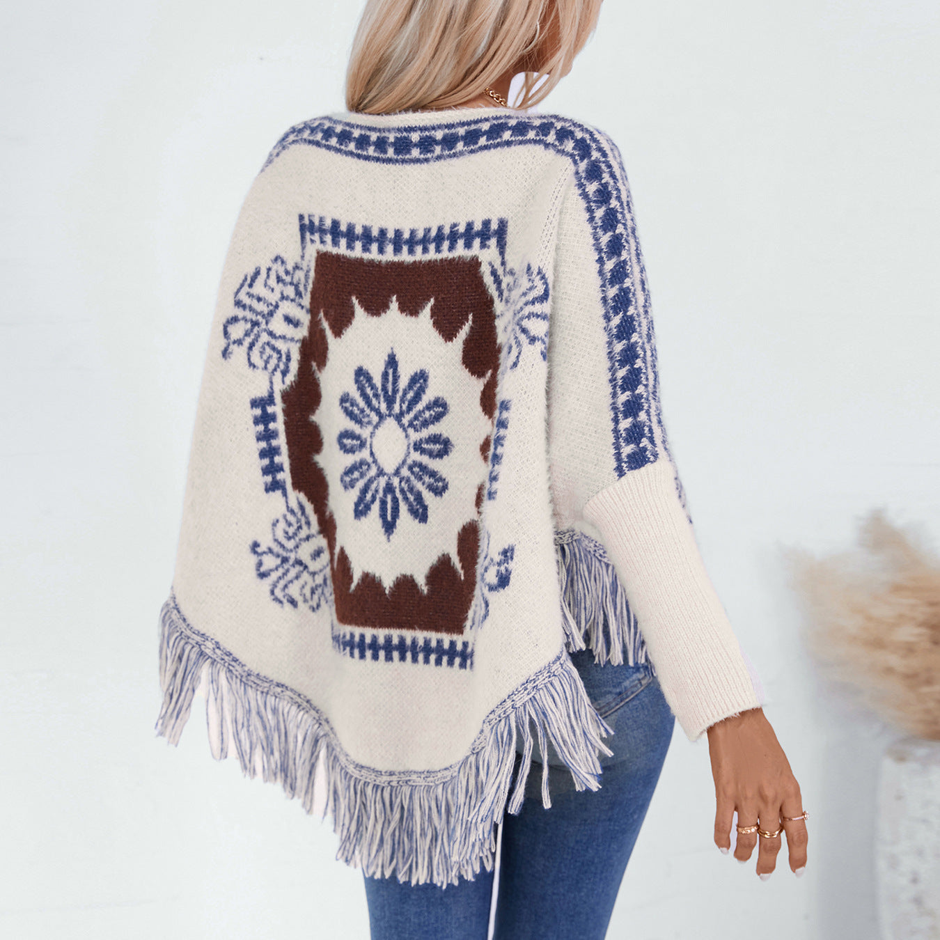 Dames élégant poncho en tricot avec motif artistique et finition à franges Chic und Stil