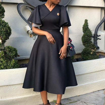 Robe portefeuille pour femmes avec une coupe fluide et des manches volumineuses Chic und Stil