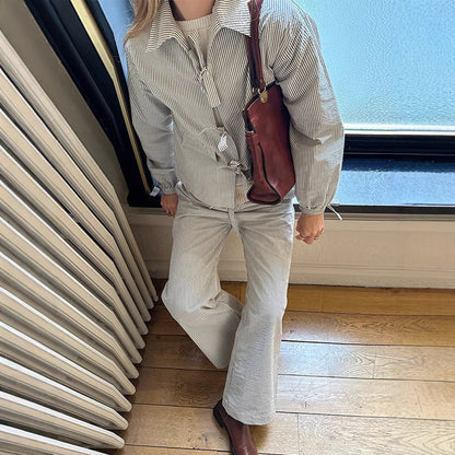 Two-piece women's striped outfit with oversized jacket and wide pants Chic und Stil