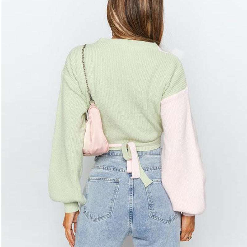 Dames Pull élégant à col en V avec des manches contrastées et une surface texturée Chic und Stil