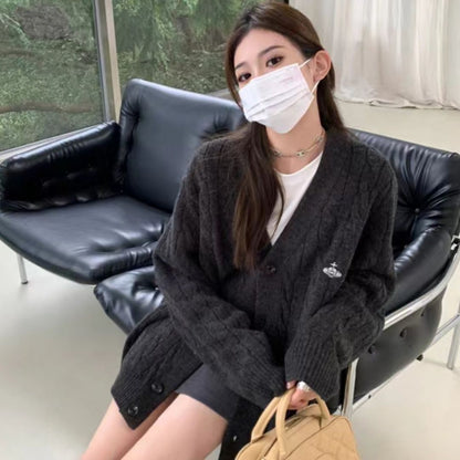 Cardigan pour femmes avec motif en câble et grands boutons Chic & Stil