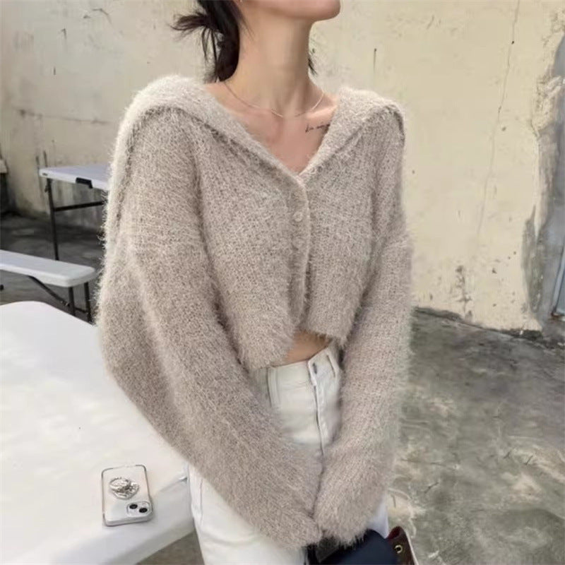 Pull décontracté pour femmes avec décolleté en V profond et motif de mailles texturé Chic und Stil