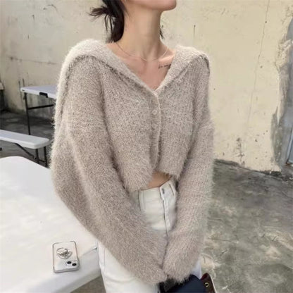 Pull décontracté pour femmes avec décolleté en V profond et motif de mailles texturé Chic und Stil