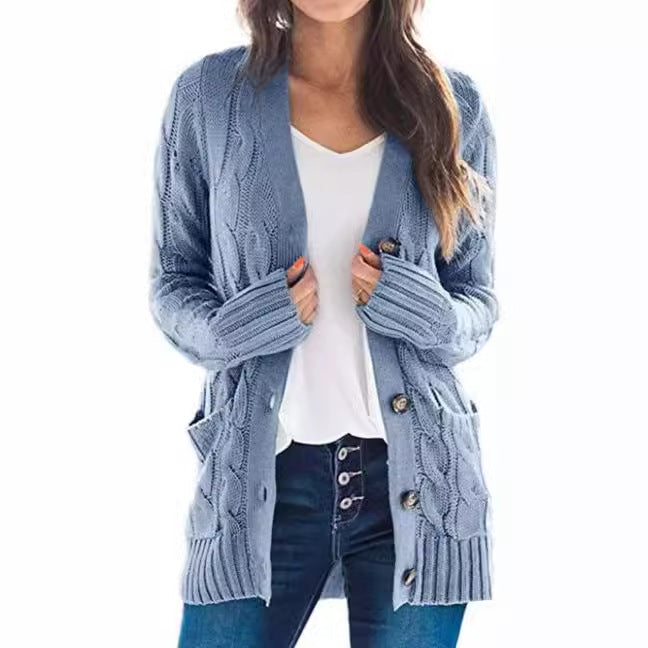 Knitted women's pullover with a structured cable pattern and practical pockets Chic and Style