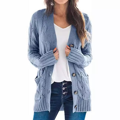 Knitted women's pullover with a structured cable pattern and practical pockets Chic and Style