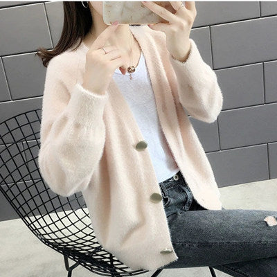 Ladies plush pullover with stylish button details Chic und Stil