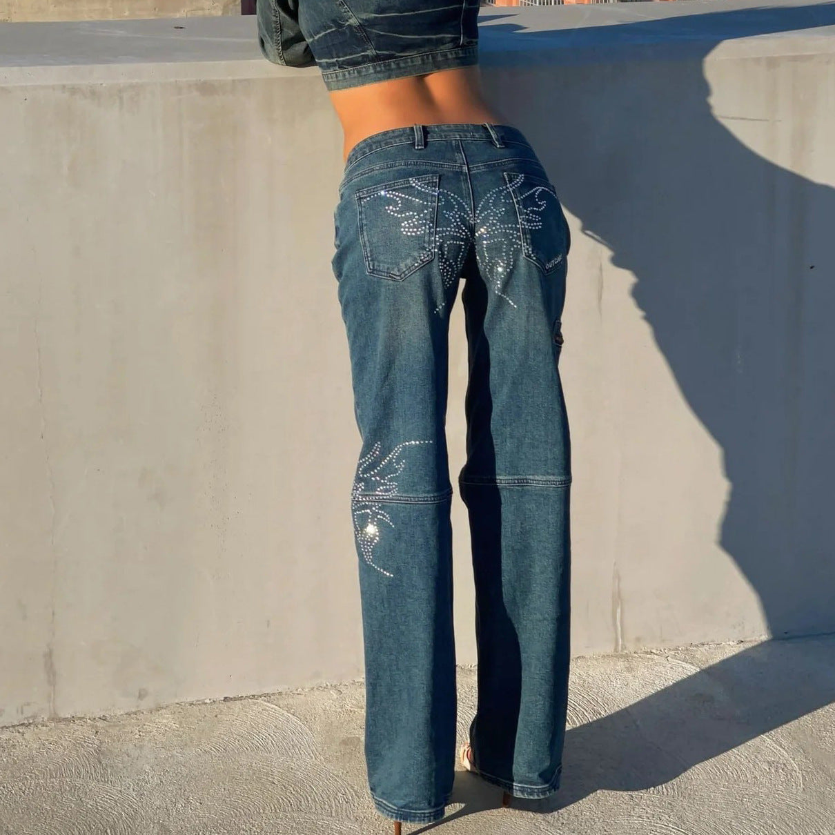 Women's denim pants with unique rhinestone applications Chic and Style