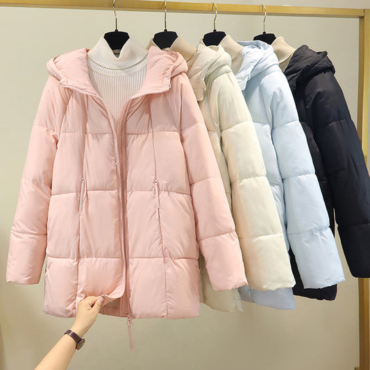 Women's comfortable and stylish puffer jacket with hood and practical zip pockets. Chic and stylish.