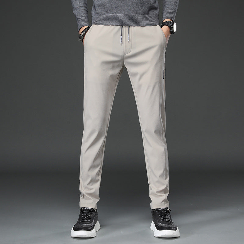 Men's slim fit sports pants with elastic waistband and practical zip pockets Chic and Style
