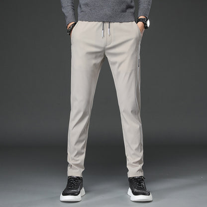 Men's slim fit sports pants with elastic waistband and practical zip pockets Chic and Style