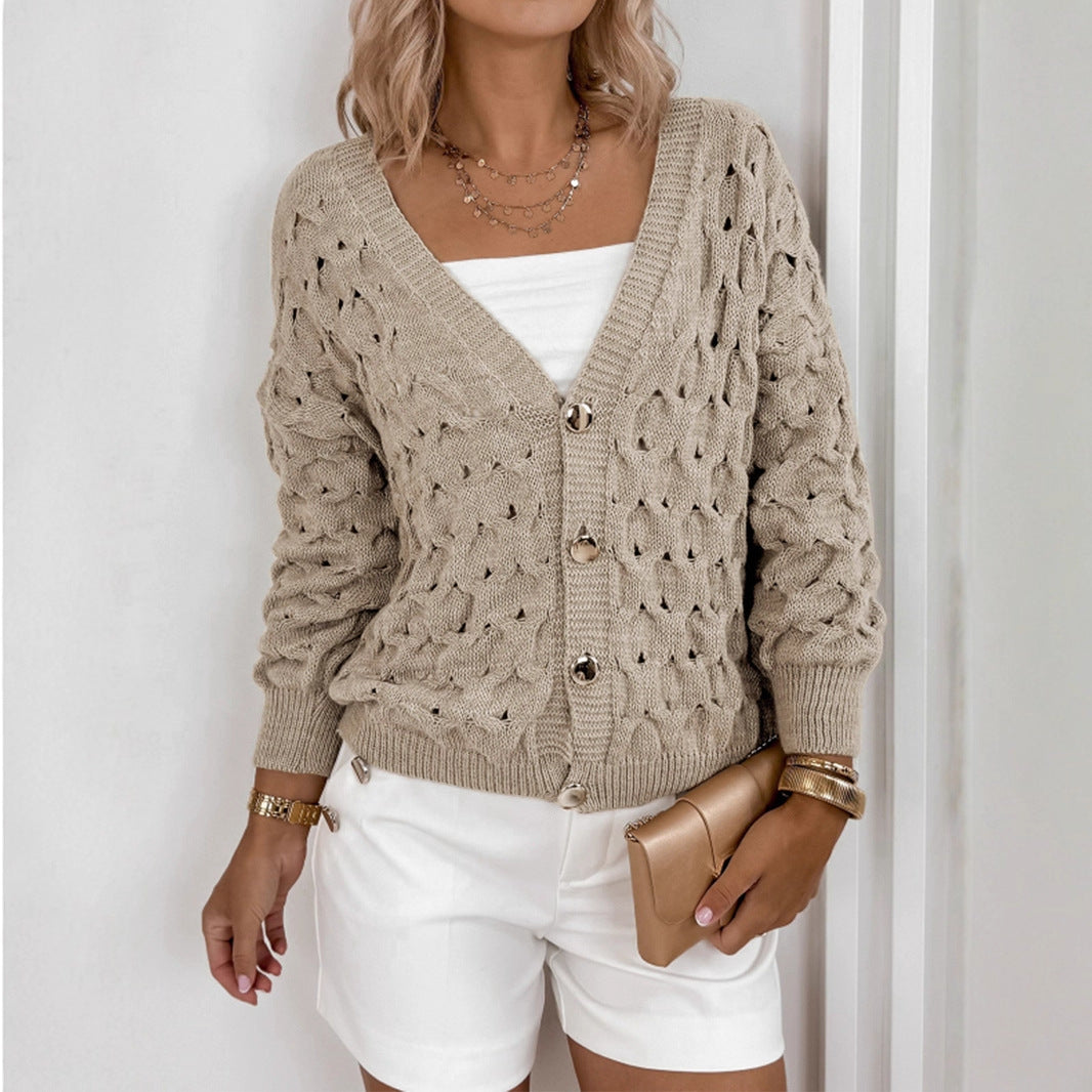 Veste en tricot pour femmes avec une structure en mailles aérées et des détails de boutons élégants Chic und Stil