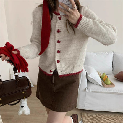Dames gilet en tricot douillet avec boutons en forme de cœur et conception de manches raffinée Chic und Stil