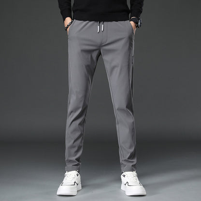 Men's slim fit sports pants with elastic waistband and practical zip pockets Chic and Style