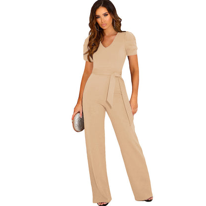 Elegant women's jumpsuit with waist belt and puff sleeves Chic and Style