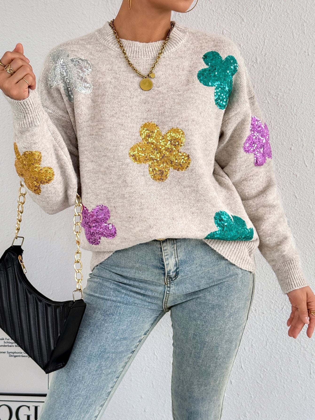 Pull en tricot pour femmes avec des appliqués de fleurs scintillants Chic und Stil