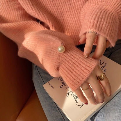 Pull en tricot pour femmes avec un look cut-out raffiné et des manches ornées de perles Chic und Stil