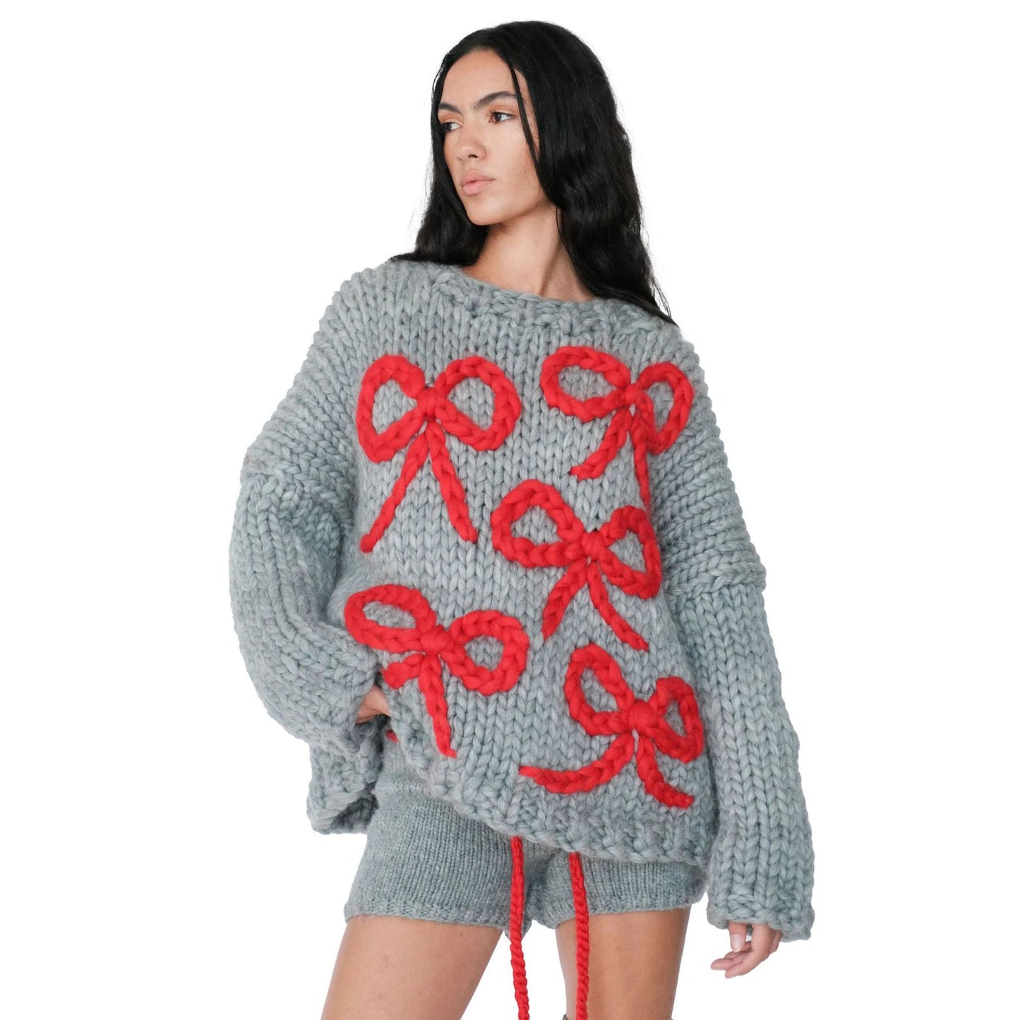 Pull en gros tricot pour femmes avec un design de nœud ludique Chic und Stil