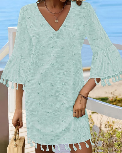 Robe de plage pour femmes avec un élégant décolleté en V et des franges décoratives Chic und Stil