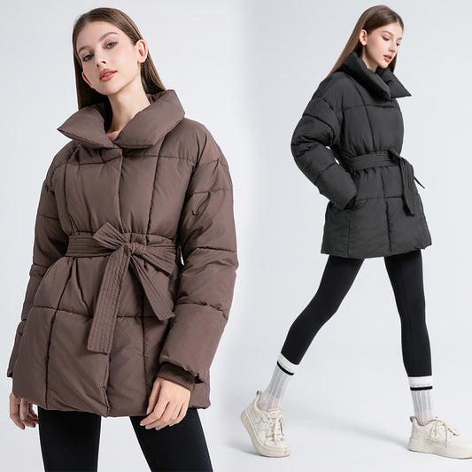 Women's comfortable and elegant down jacket with belt and stand-up collar. Chic and stylish.