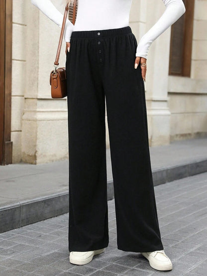 Loose fabric pants for women with a button row and elastic waist Chic and Style