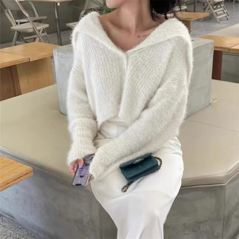 Pull décontracté pour femmes avec décolleté en V profond et motif de mailles texturé Chic und Stil