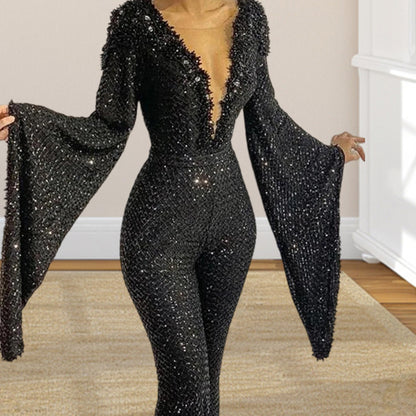 Ladies' glamorous jumpsuit with sparkling sequins and wide sleeves. Chic and stylish.